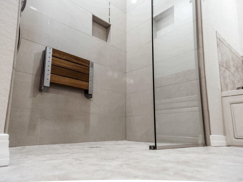 tub to shower conversion in Youngstown, Ohio; shower seat inside of a walk-in shower; shower renovation